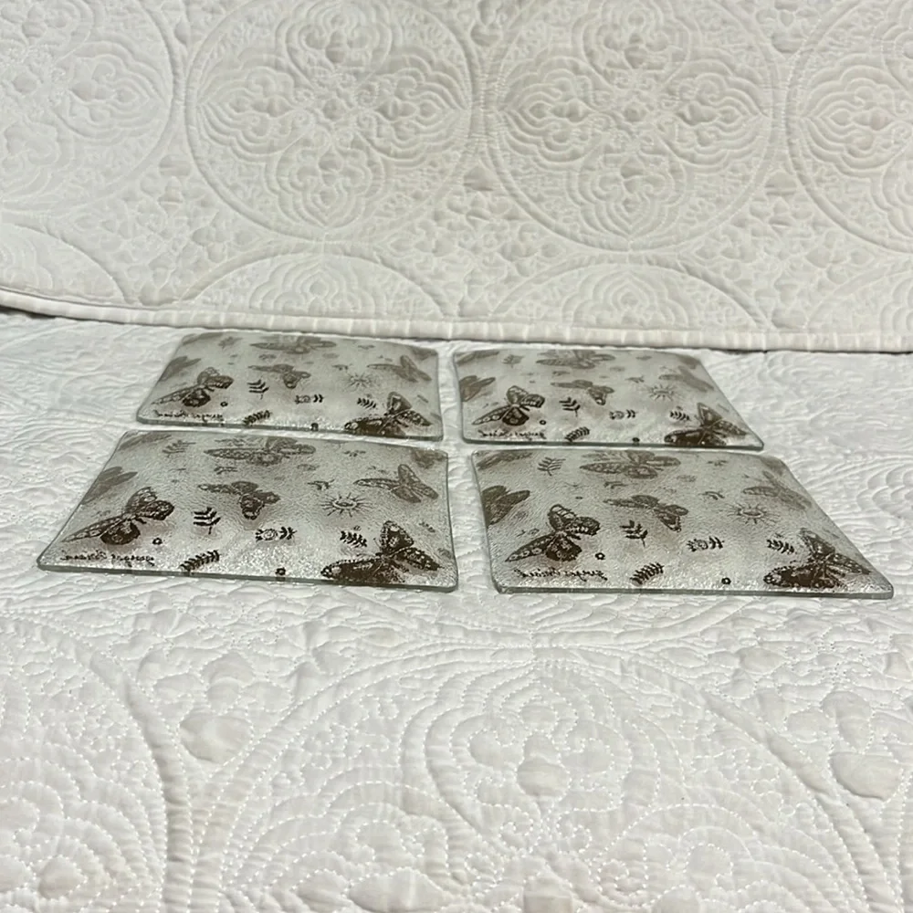 Set of four Georges‎ Briard square plates